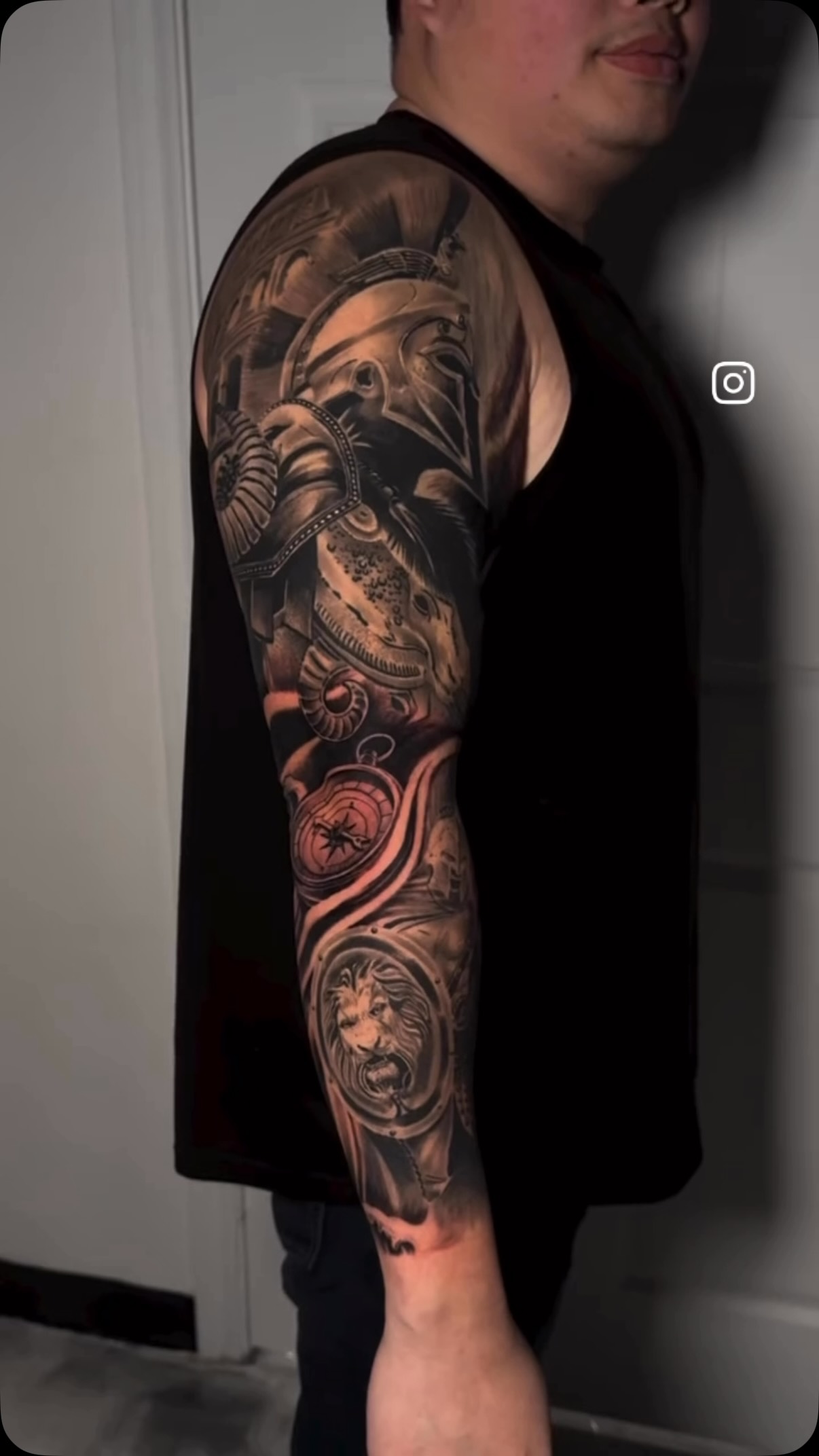 Detailed black and gray sleeve tattoo by Tony